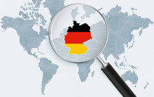 World Map With A Magnifying Glass Pointing At Germany. Map Of Germany With The Flag In The Loop.