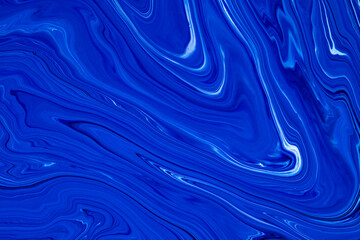 Wall Mural - Fluid art texture. Abstract backdrop with iridescent paint effect. Liquid acrylic picture that flows and splashes. Classic blue color of the year 2020. Blue and white overflowing colors.