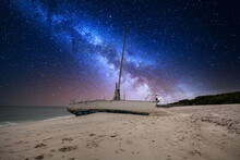 Milky Way In The Night Sky Over A Shipwreck Off The Coast Of Clam Pass