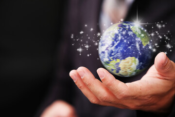 Poster - Human hand holding earth globe on blue  background, Global networking connection and data exchanges, global communication network concept