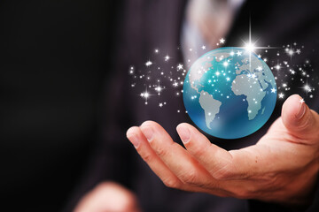 Poster - Human hand holding earth globe on blue  background, Global networking connection and data exchanges, global communication network concept