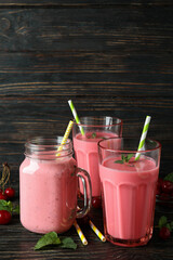 Wall Mural - Cherry smoothie and ingredients on rustic wooden table