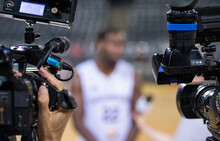 Basketball Player Giving An Interview Focus On Professional Cameras