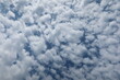 Altocumulus clouds. The sun shines through the Altocumulus clouds. Cloudscape with altocumulus clouds at sunny day