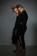 © Alexander - Two beautiful blonde girls in black clothes are standing next to each other