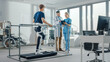 © Gorodenkoff - Modern Hospital Physical Therapy: Patient with Injury Walks on Treadmill Wearing Advanced Robotic Exoskeleton Legs. Physiotherapy Rehabilitation Scientists, Engineers, Doctors use Tablet Computer