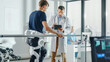 © Gorodenkoff - Modern Hospital Physical Therapy: Doctor Uses Tablet Computer, Helps Disabled Patient with Injury Walk on Treadmill Wearing Advanced Robotic Exoskeleton Legs. Physiotherapy Rehabilitation Technology