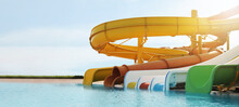 Beautiful View Of Water Park With Colorful Slides And Swimming Pool On Sunny Day. Banner Design