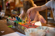 © Austockphoto - Girls drawing with coloured pencils in an early education setting