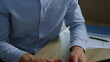 © stockbusters - Businessman hands pushing keys on laptop. Male executive arms typing on computer
