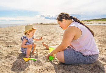 Wall Mural - Portrait of trisomy adult outside having fun with baby