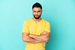 © luismolinero - Young arab man isolated on blue background with unhappy expression