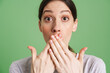 © Drobot Dean - Young white woman expressing surprise and covering her mouth