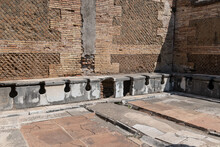 Latrina Presso Le Terme Del Foro. Ancient Public Toilets (latrines) Located At Ostia Atica (the Ancient Port Of Rome)