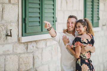 Canvas Print - Couple Pointing To Something While Walking Through Old City