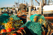 Netting and other fishing gear sits on a commercial fishing fleet dock