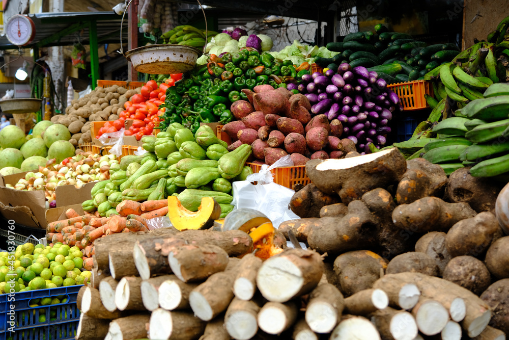 Colorful fresh fruits and vegetables on display at the outdoor farmers ...