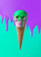 Icecream Cone With Pink Skull And Green Toping. Spooky Halloween Concept. Vivid Colors Background.