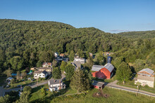 Aerial View Of Starrucca Pennsylvania In Waybe County A Historic Borough Along The New York State Border Consisting Of 2 Small Streets Rural Village In The Valley With A Barn, Inn, Post Office