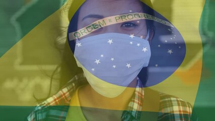 Sticker - Animation of flag of brazil waving over woman in face masks