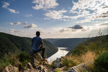 Man Looking At The Gorges De La Dordogne In The Golden Light In Correze - France - July 2021