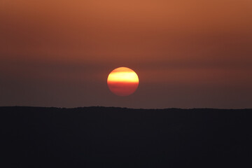 Wall Mural - sunset and orange sunrise over the mountains