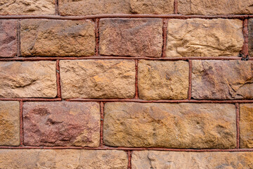 Sticker - Closeup of an orange brick wall.