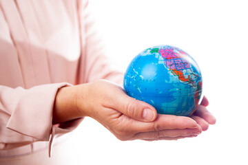 woman holds planet earth in her hand on a white background, isolate