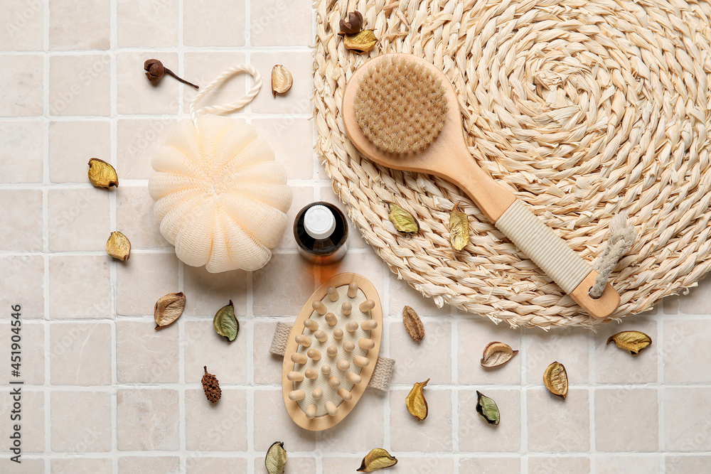 Composition with different body brushes on light tile background