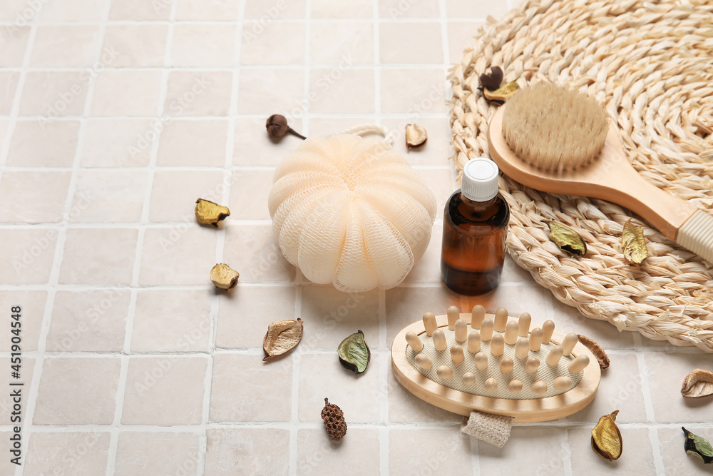 Composition with different body brushes on light tile background