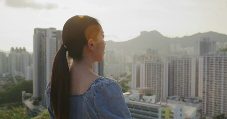 Wall Mural - Woman look at the city in Hong Kong