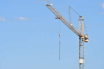 crane against blue sky in a construction site