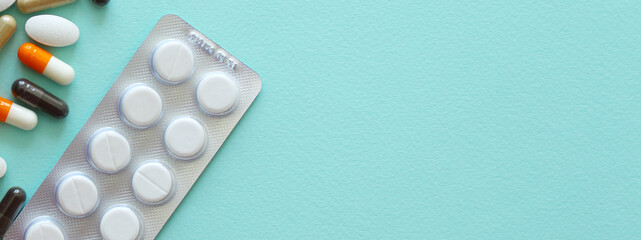 packaging for drugs: painkillers, antibiotics, vitamins and aspirin tablets. Set of white blisters with pills and capsules.