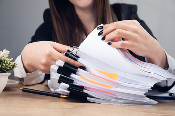 Wall Mural - woman holding stack of business documents