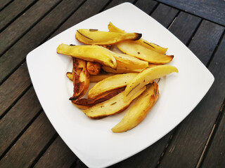 Sticker - Plate of fresh rustic potatoes on a wooden table