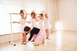 © standret - Working with coach. Little ballerinas preparing for performance by practicing dance moves