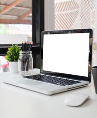 Wall Mural - Computer laptop with white screen on office desk.
