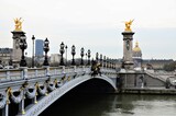 Fototapeta Paryż - The famous Alexandre III Bridge at sunset in Paris, France