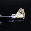 THC Cannabis Diamonds laying on a glass dab tool. 