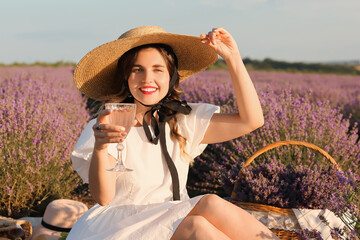 Sticker - Beautiful young woman having picnic in lavender field