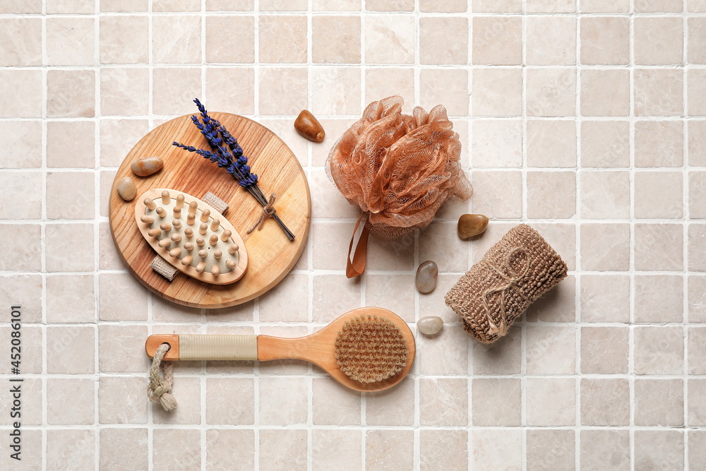 Composition with different body brushes on light tile background