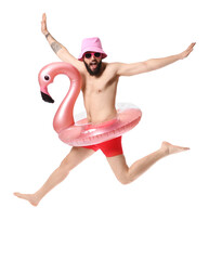 Wall Mural - Funny jumping young man with inflatable ring on white background