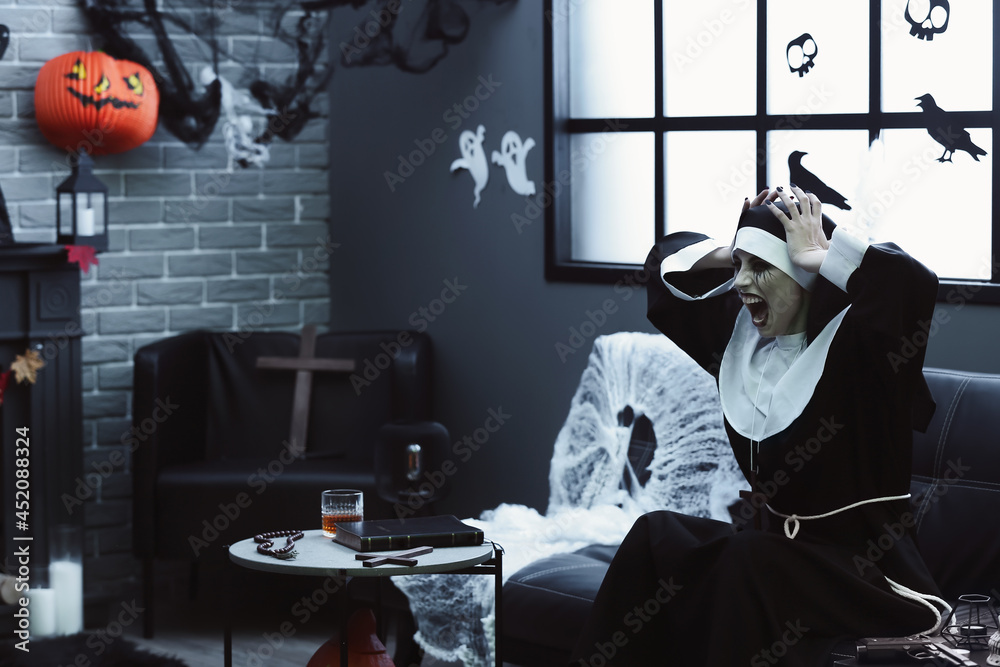 Woman dressed as nun at Halloween party