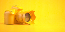 Yellow DSLR Photo Camera On Yellow Background.