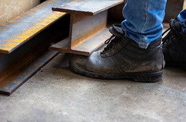 Wall Mural - Wear safety shoes to ensure safety at work. construction workers wear safety shoes. concept.