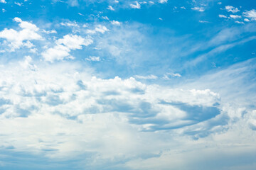Wall Mural - Stunning view of a blue sky with some clouds during a sunny day. Natural background with copy space