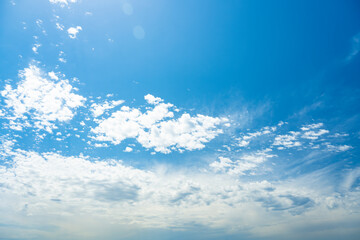 Wall Mural - Stunning view of a blue sky with some clouds during a sunny day. Natural background with copy space