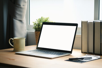 Poster - Mock up with home office desk with blank screen of laptop computer.