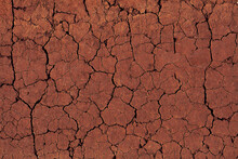 Background Of Cracked Red Earth. Texture Of Dessert, Global Warming And Climate Change Concept
