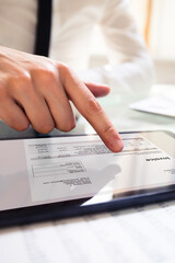 Aufkleber - Businessperson Analyzing Invoice On Digital Tablet